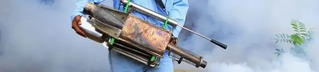 Fumigation technician using a fogger for deep pest treatment in Denver, CO